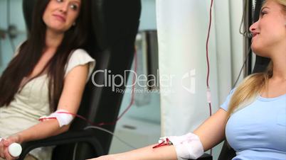 Two patients receiving a transfusion