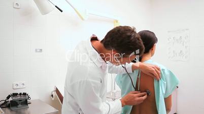 Doctor auscultating a patient