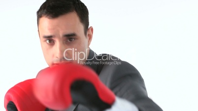 Businessman removing his stress by boxing