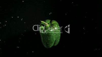 Wet pepper rotating in super slow motion