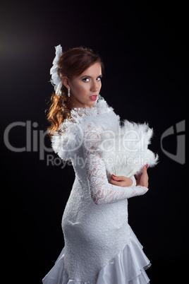 Woman in white dress performing flamenco