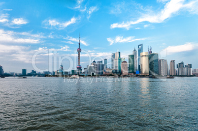 Shanghai skyscrapers at evening near water