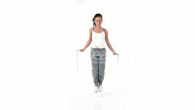 Woman jumping with a skipping rope