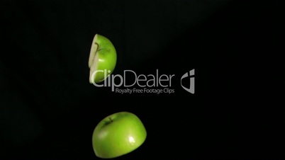 Apples halves rotating in super slow motion