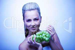 Frozen woman take grapes
