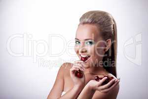 Happy smile woman eat red cherry