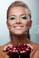 Smile woman offer your taste ripe cherry