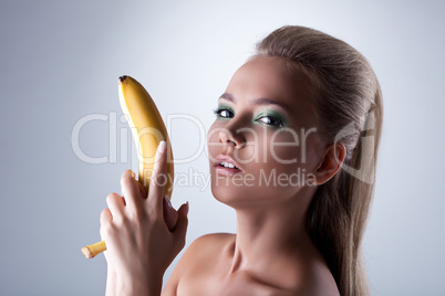 sexy girl take long banana like gun