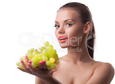 funny young woman offer green grapes