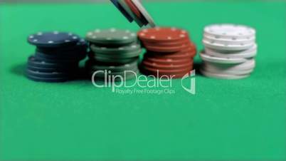 Gambling chips falling down in super slow motion