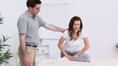 Physiotherapist working with one of his patient