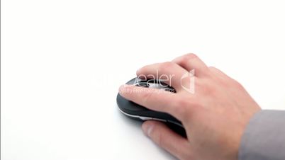 Hand holding and moving a computer mouse