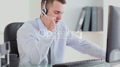 Young businessman speaking in a headset