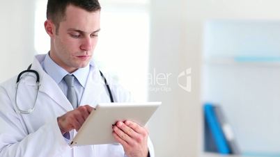 Doctor using a tactile tablet