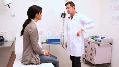 Doctor checking the reflexes of the knee of a patient