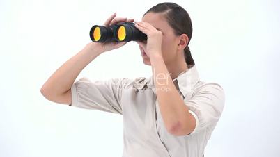 Businesswoman holding binoculars