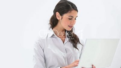 Smiling woman using a laptop
