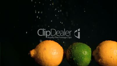 Limes and lemons in super slow motion receiving water
