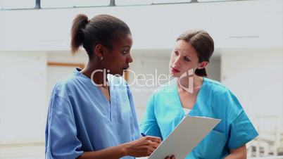 Nurses looking at a medical chart