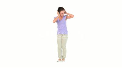 Woman standing while listening to music