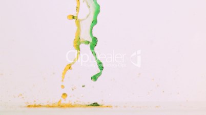 Colored liquid splashing in super slow motion on the ground