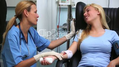 Nurse smiling to a blood donor