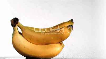 Delightful bananas in super slow motion being wet