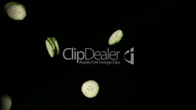 Cucumber slices jumping in super slow motion