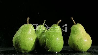 Tasty pears in super slow motion being soaked
