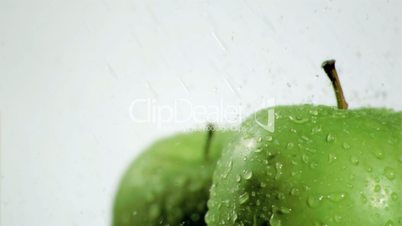 Water pouring in super slow motion on apples