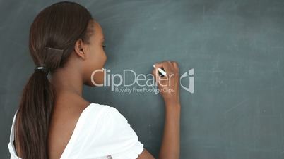 Video of a student writing on a blackboard