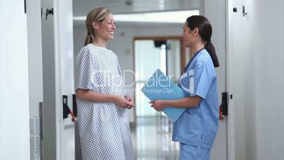 Nurse walking with a patient in a hospital