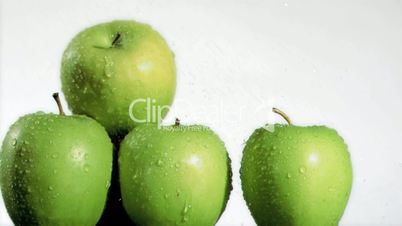 Water dripping in super slow motion on apples