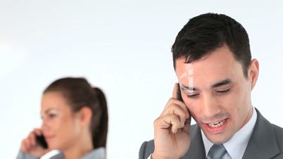 Businesswoman and businessman calling