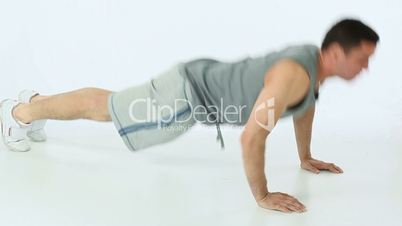 Man doing push ups and clapping
