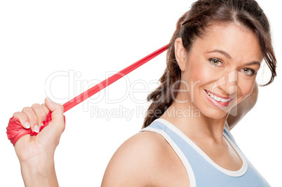 Frau mit rotem Gymnastikband