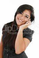 Closeup of beautiful young woman speaking on cell phone