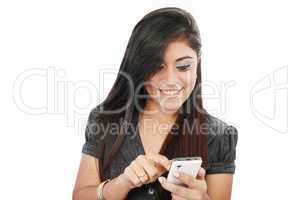 portrait of a happy young business woman texting from her cellph