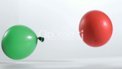 Two balloons rebounding in super slow motion