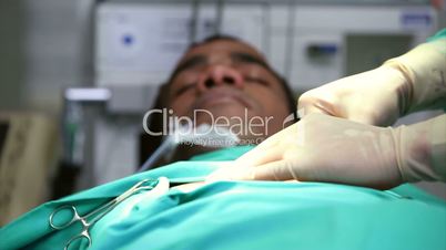 Unconscious male patient on an operating table