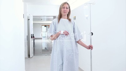 Patient walking in the corridor with an intravenous drip