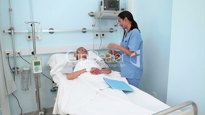 Nurse examining a patient with a stethoscope