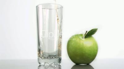Apple juice flowing in super slow motion