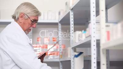 Pharmacist behind a hospital counter