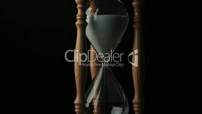 Sand falling from a hourglass