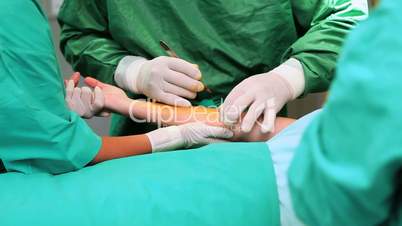 Surgeon incising a patient