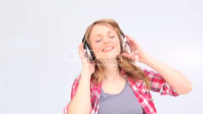 Woman dancing while she is listening to music