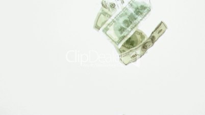 Dollar banknotes falling down in super slow motion