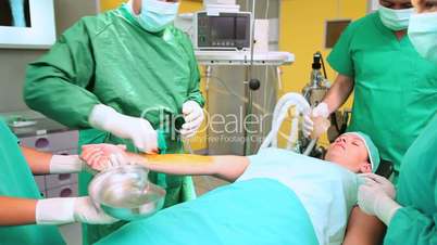 Surgeon disinfecting the arm of a patient