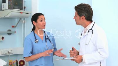 Nurse and a doctor speaking